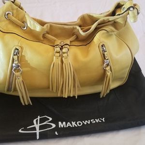 B. Makowsky yellow bucket handbag